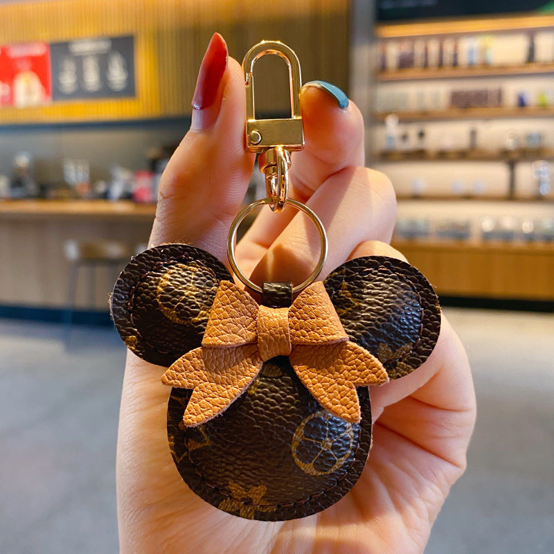 Portachiavi Mickey di lusso – Charm in ecopelle e pon-pon di pelliccia